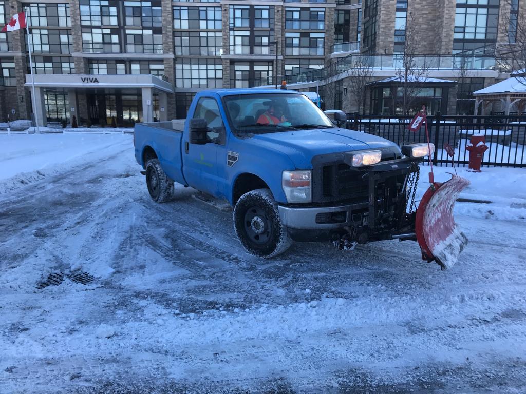 Snow removing car in action.